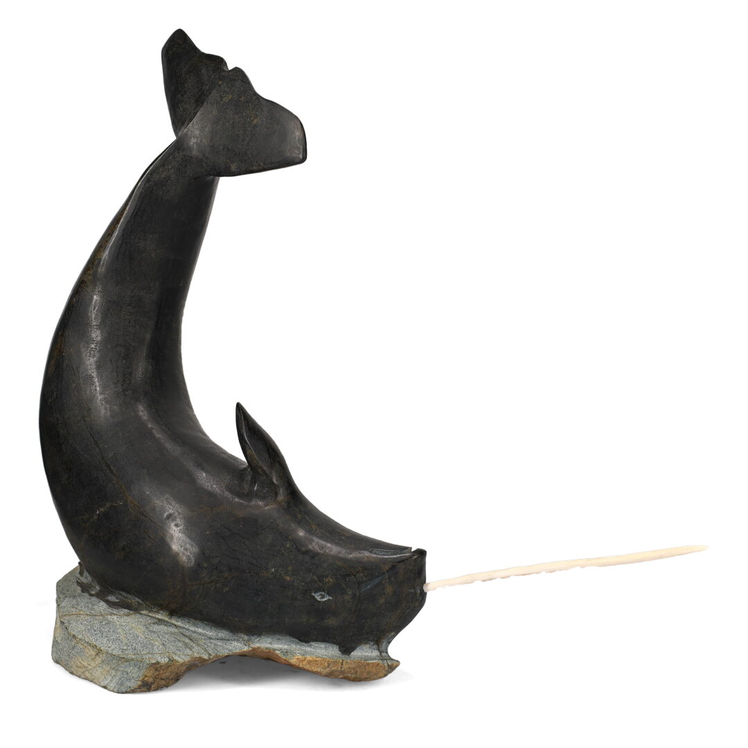 One original hand-carved sculpture by Inuit artist, Jaco Ishulutaq. One Narwhal carved out of serpentine and antler.