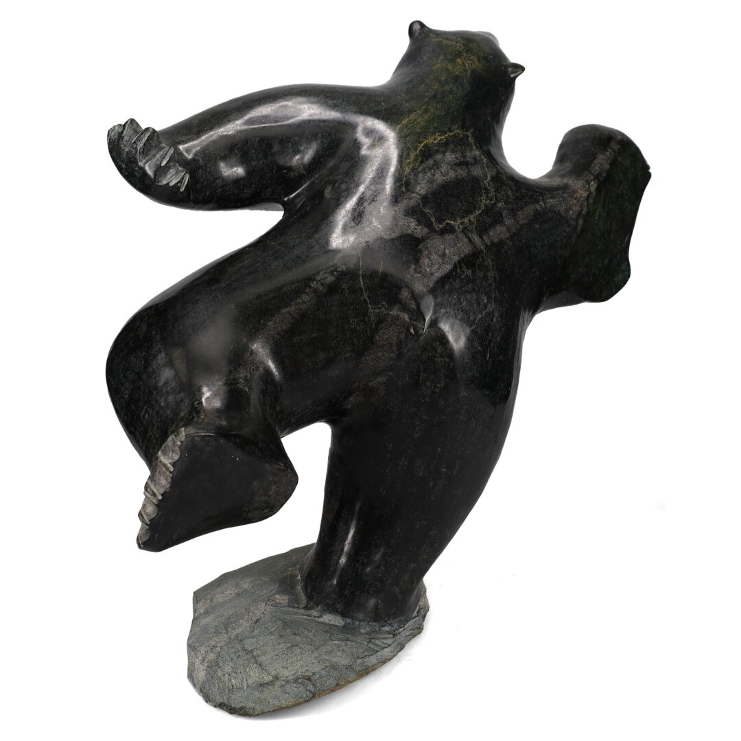 One original hand-carved sculpture by Inuit artist, Jaco Ishulutaq. One dancing bear carved out of serpentine.