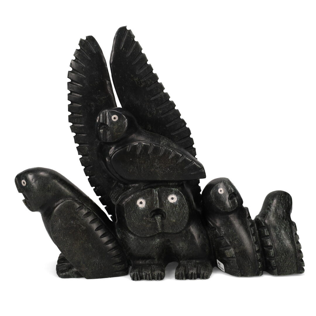 One original hand-carved sculpture by Inuit artist Palaya Qiatsuk. One owl with four chicks carved out of serpentine and marble.