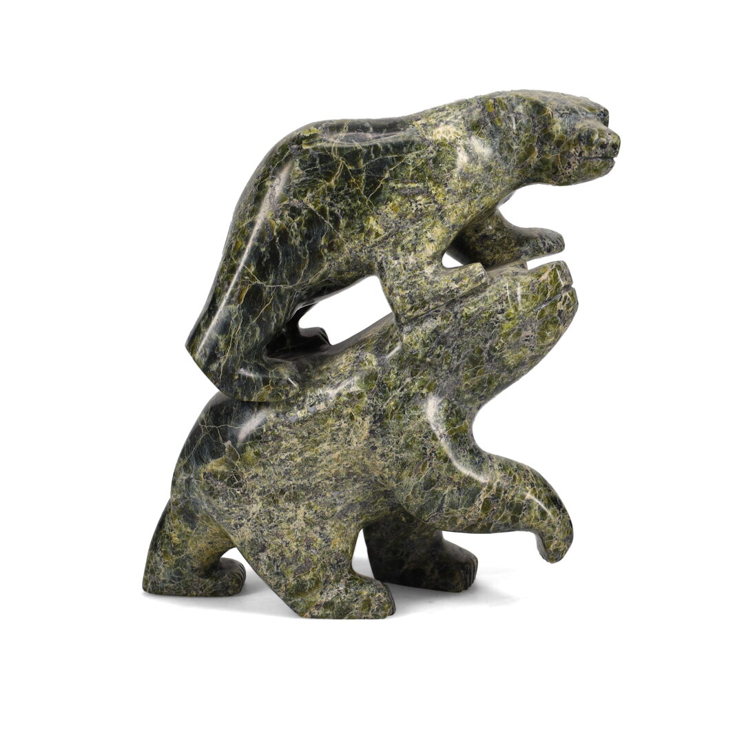 One original hand-carved sculpture by Inuit artist, Kakee Peter. One bear with cub carved out of serpentine.