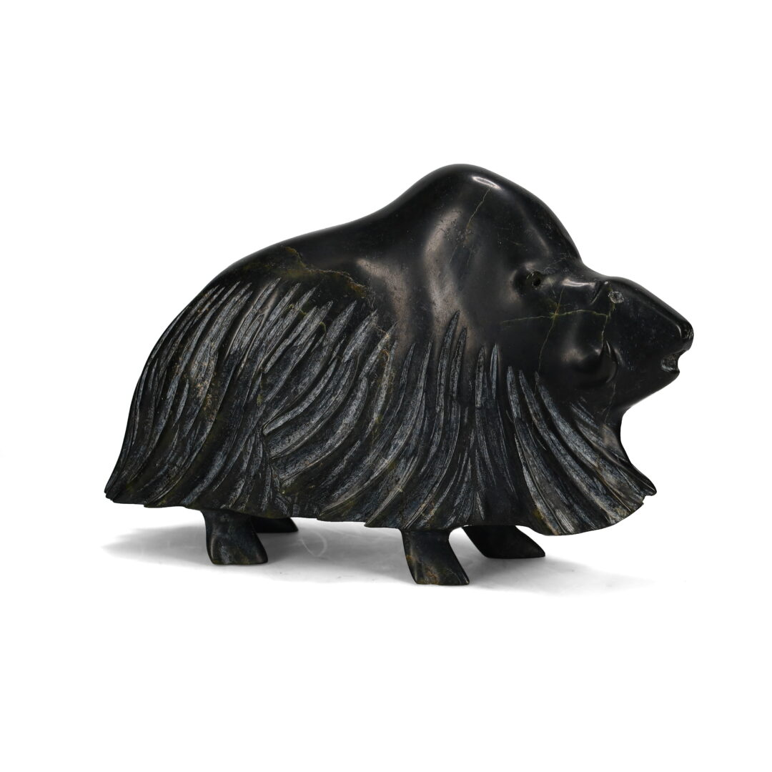 One original hand-carved sculpture by Inuit artist Kananginak Pootoogook. One musk ox carved out of serpentine.