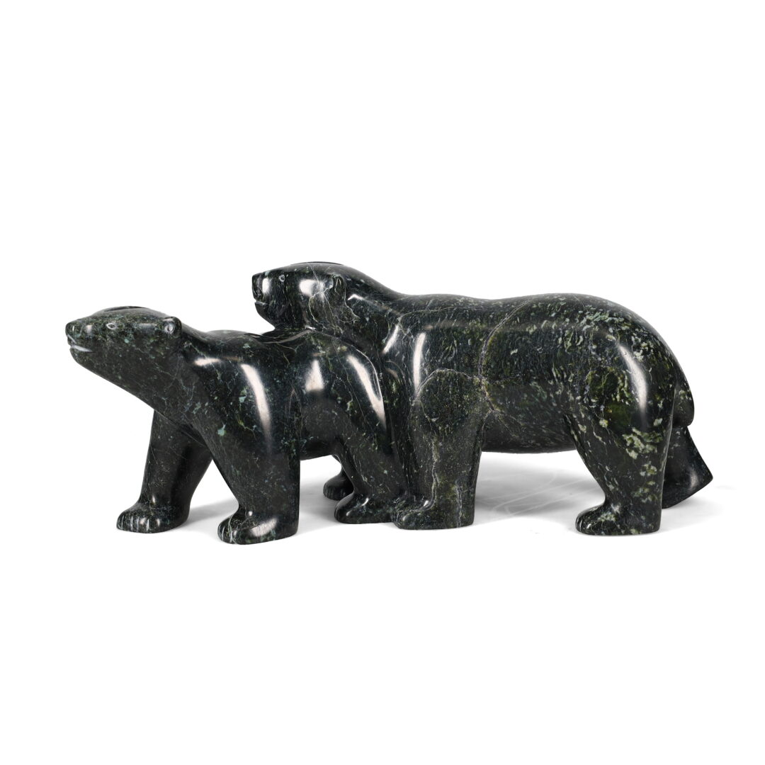 One original hand-carved sculpture by Inuit artist, Tak Nuna. One bear and her cub carved out of serpentine.