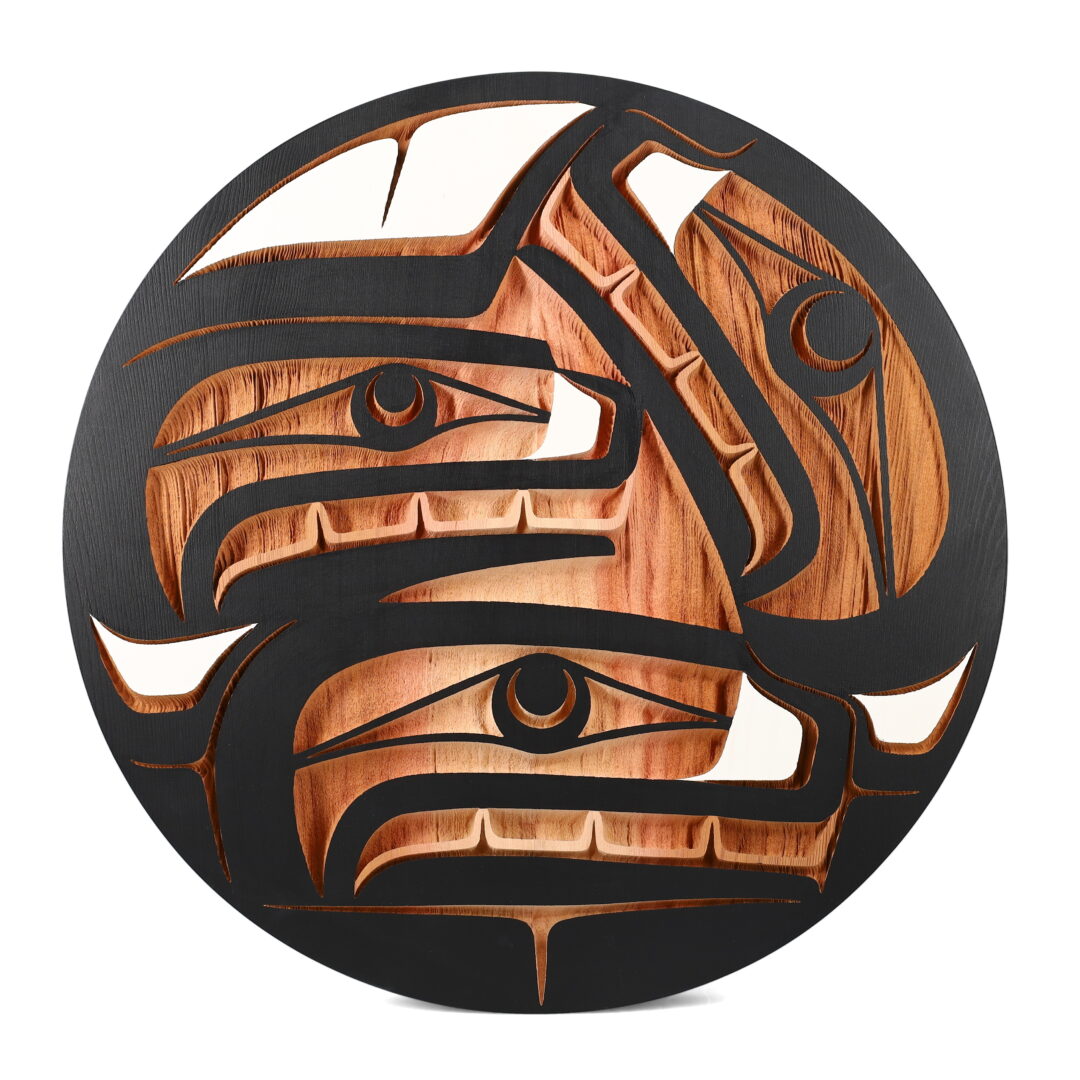 One original panel carved by Nuxalk artist, Nusmata. One Orca family of three carved in cedar wood and painted.
