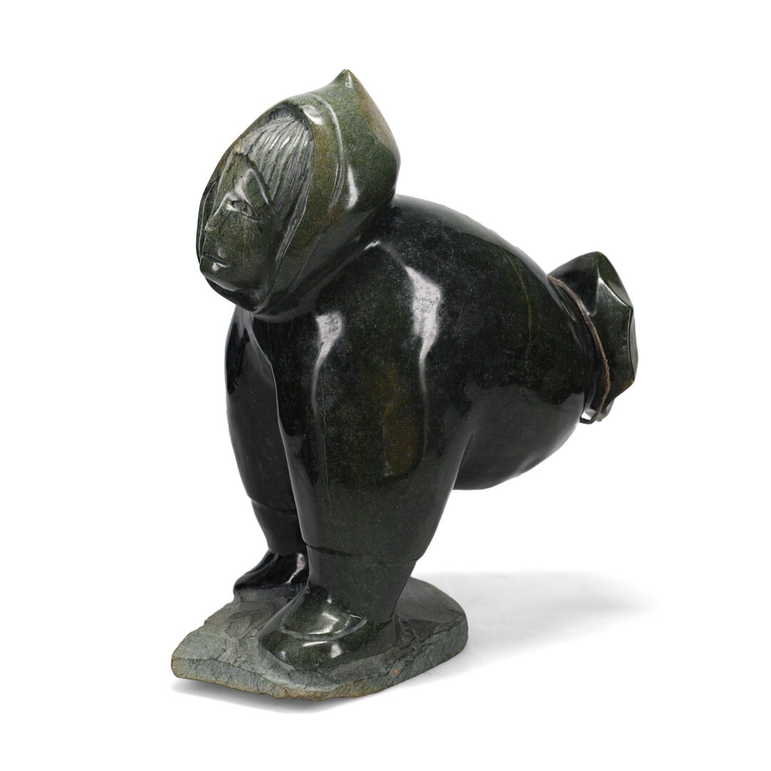 One original hand-carved sculpture by Inuit artist, Jaco Ishulutaq. One raven game carved out of serpentine.