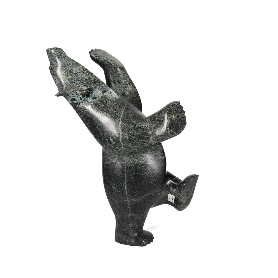One original hand-carved sculpture by Inuit artist, ___ One ___ carved out of serpentine.