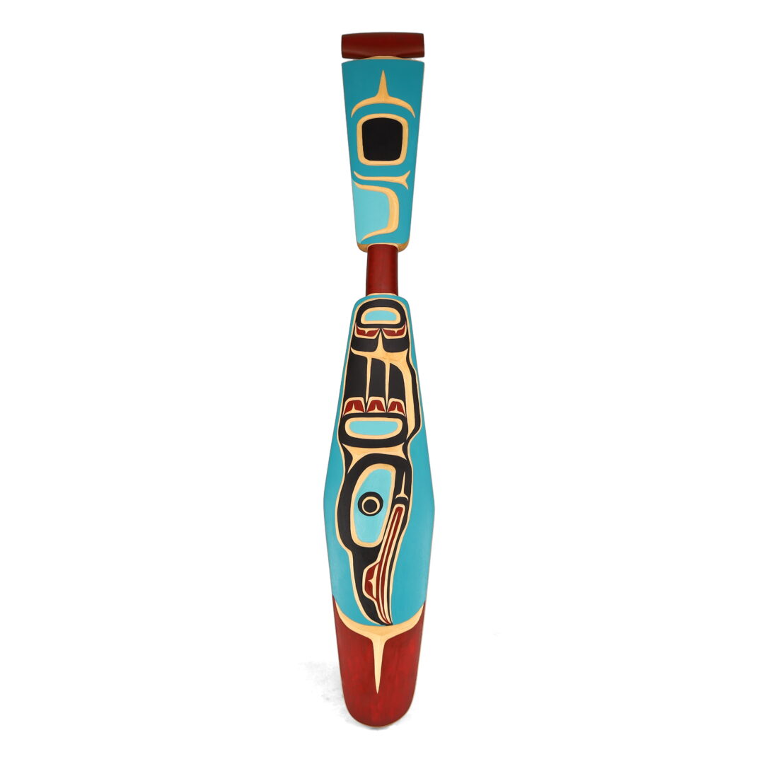 One original hand-carved sculpture by Kwakwaka’wakw artist, Peter Smith. One hummingbird paddle carved out of cedar.