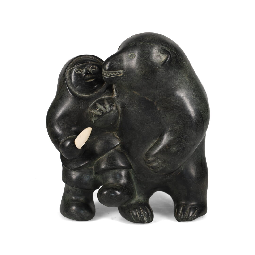 One original hand-carved sculpture by Inuit artist, Mathew Aqigaaq. One hunter fighting a bear carved out of basalt.