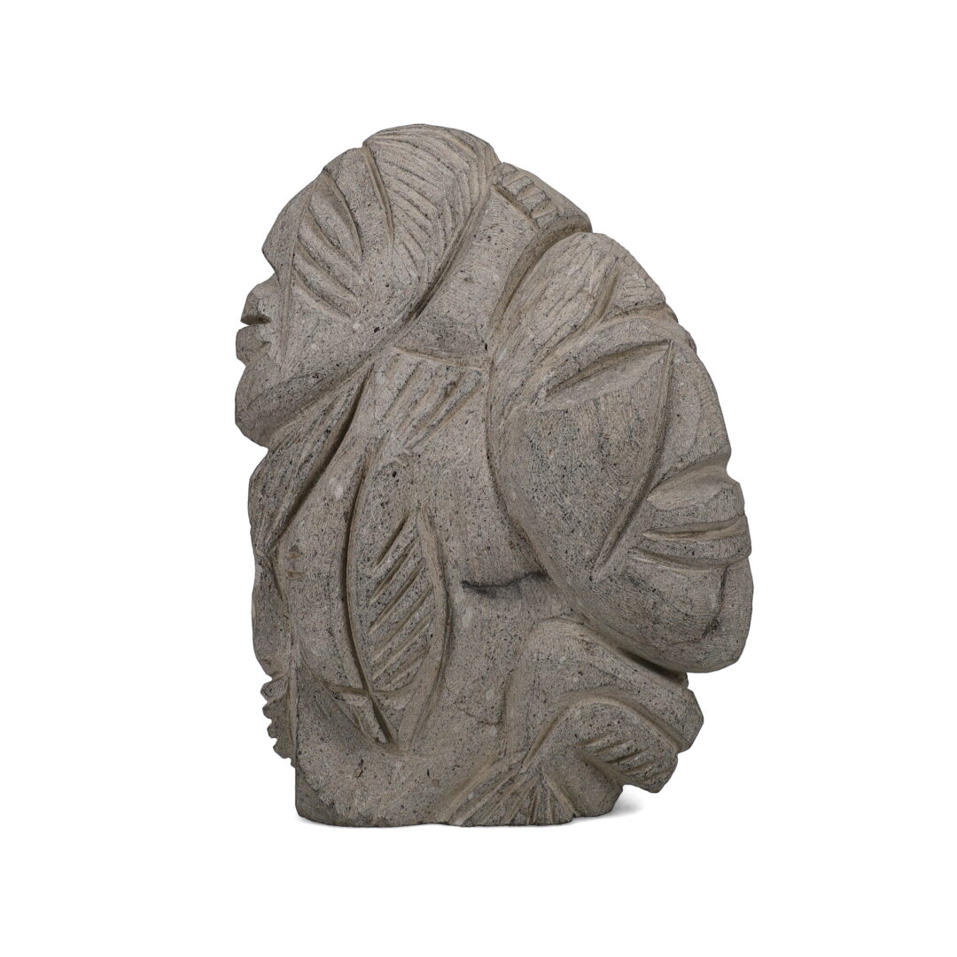 One original hand-carved sculpture by Inuit artist, Jerome Napayok. One collage with faces carved out of basalt.