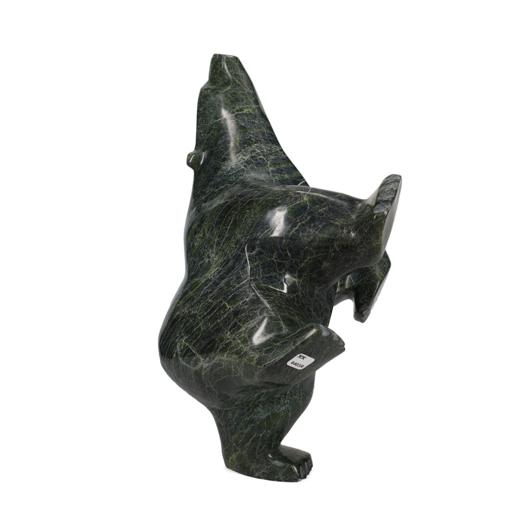 One original hand-carved sculpture by Inuit artist, Joanie Ragee. One dancing bear carved out of serpentine stone.