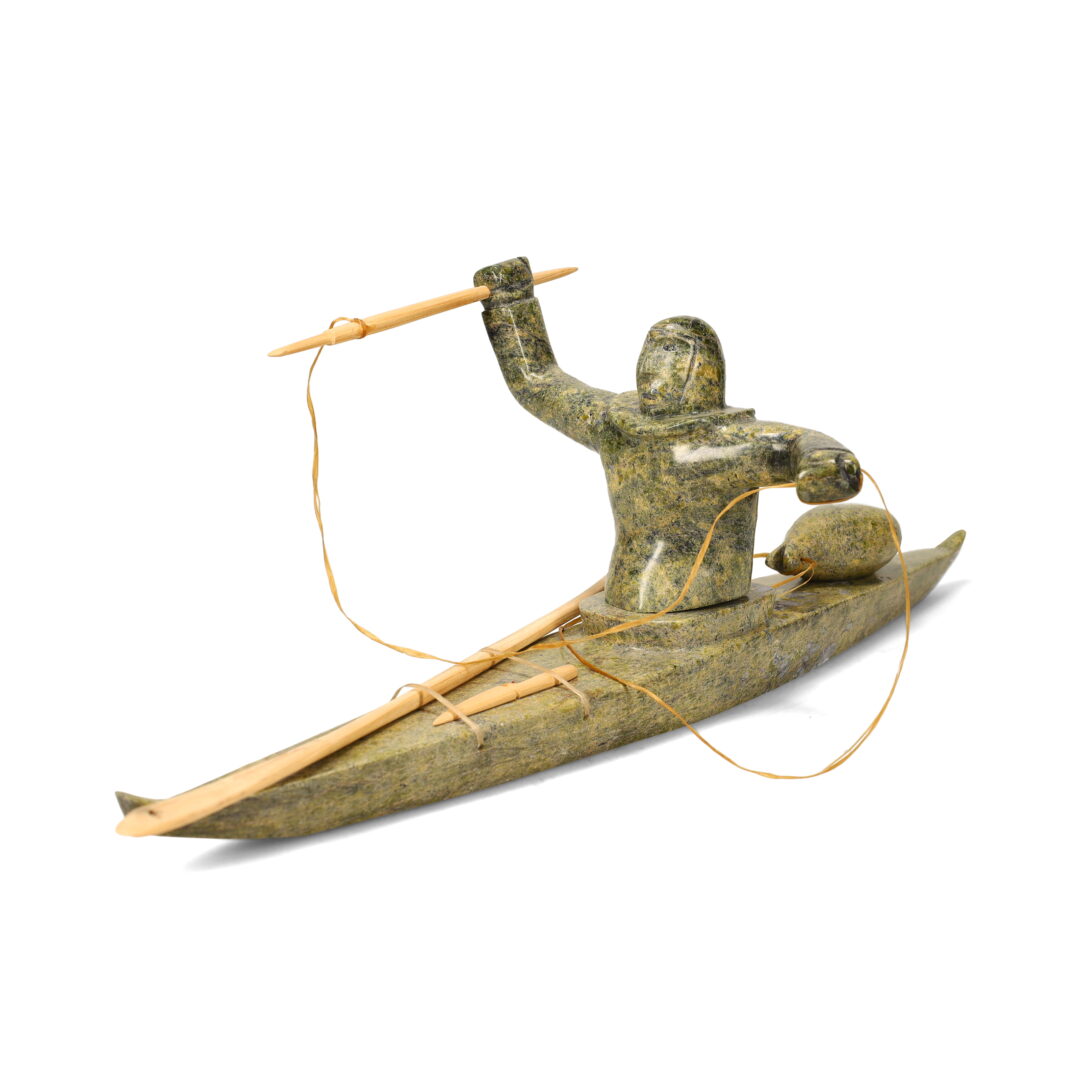 One original hand-carved sculpture by Inuit artist, Noah Jaw One kayaker carved out of serpentine with wooden tools.