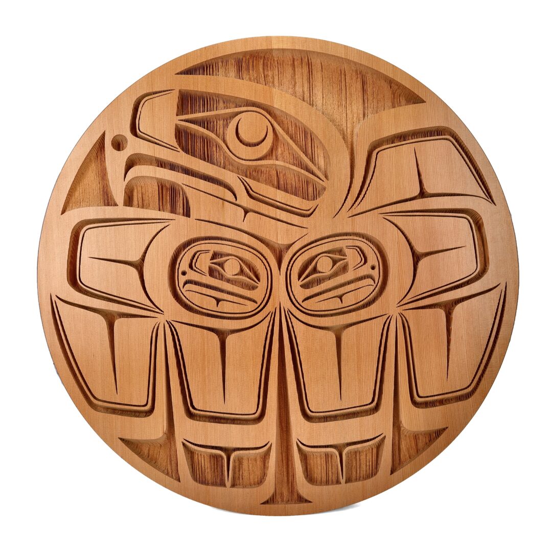 One original wooden panel by Nuxalk artist, Nusmata. One eagle carved out of unpainted natural cedar wood.