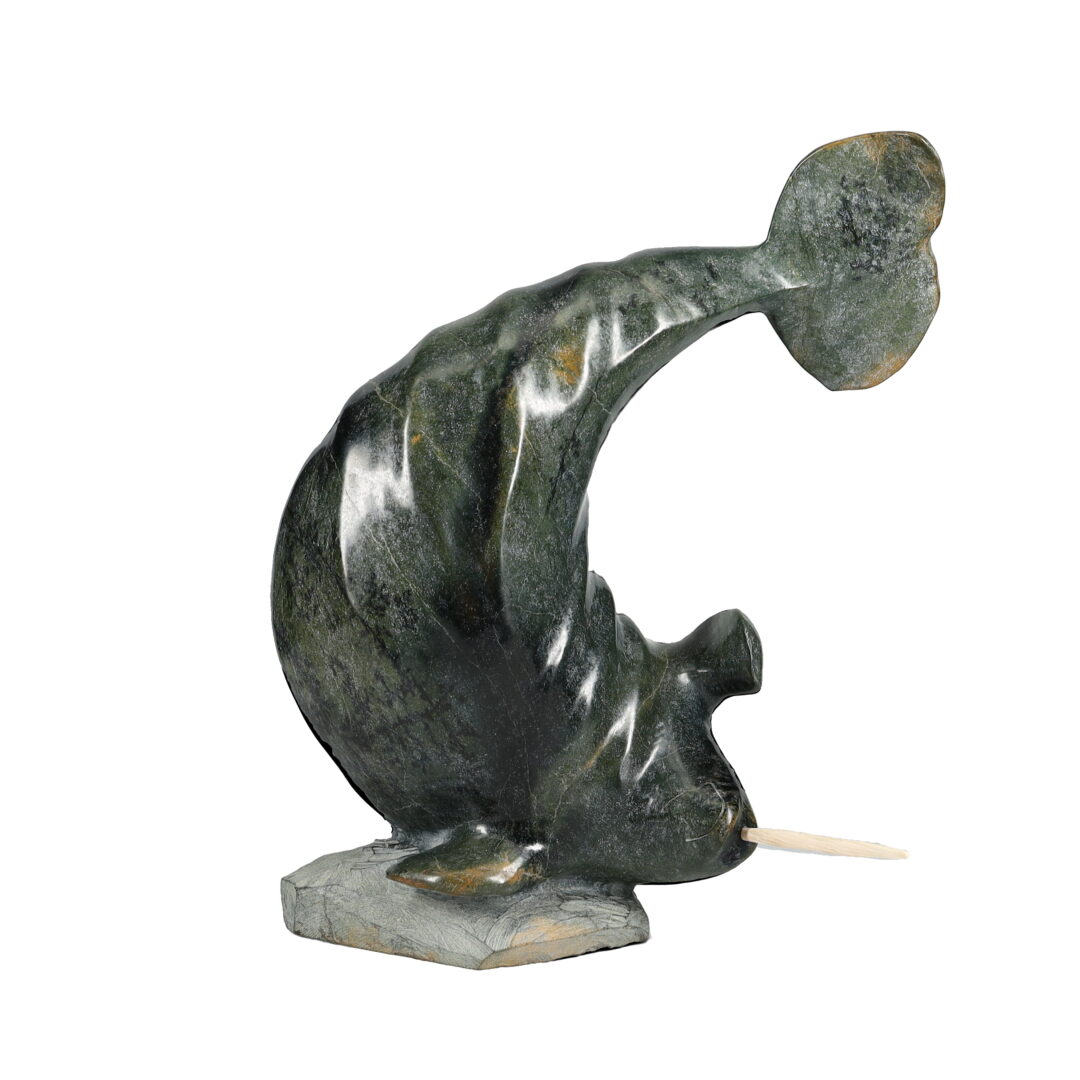 One original hand-carved sculpture by Inuit artist Jaco Ishulutak. One narwhal carved out of serpentine.