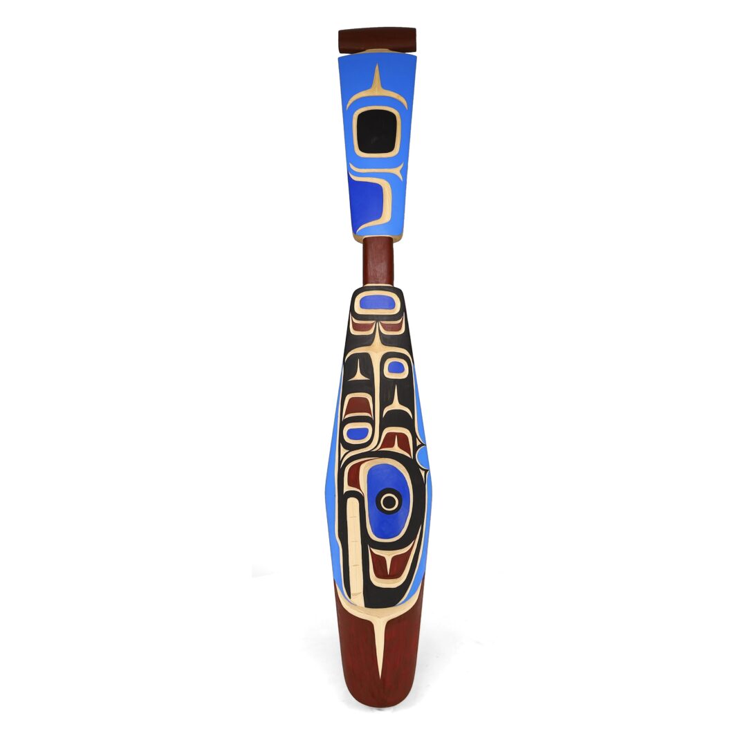 One original hand-carved paddle by Kwakwaka’wakw artist, Peter Smith. One killer whale paddle carved out of cedar.