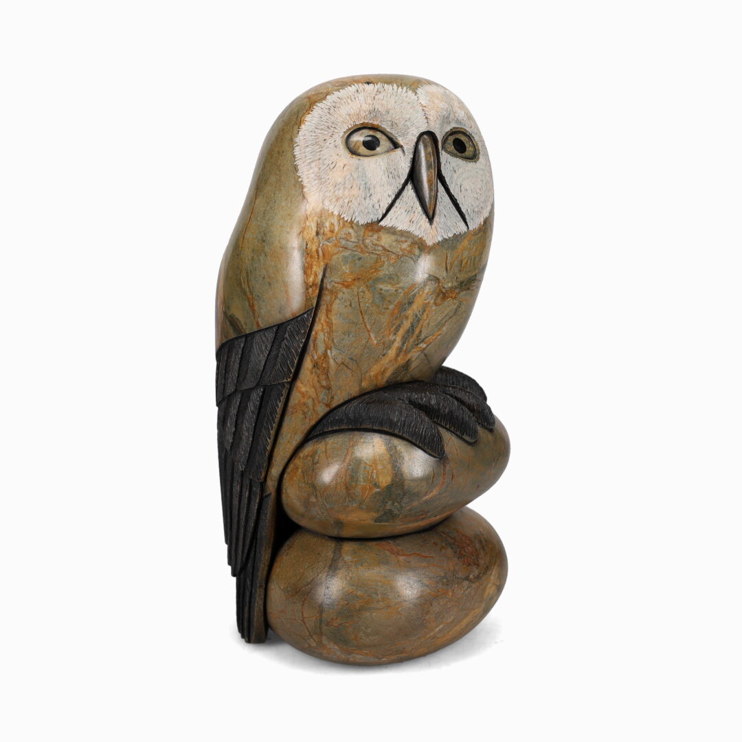 One original hand-carved sculpture by Onondaga artist, Cyril Henry. One owl one stones carved out of soapstone.