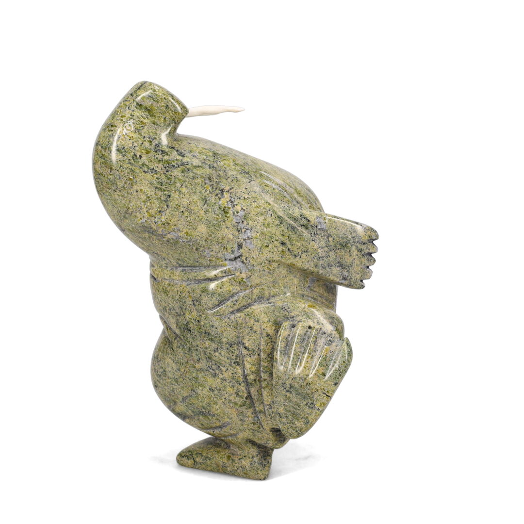 One original hand-carved sculpture by Inuit artist, Pitsulak Qimirpik. One dancing walrus carved out of serpentine.