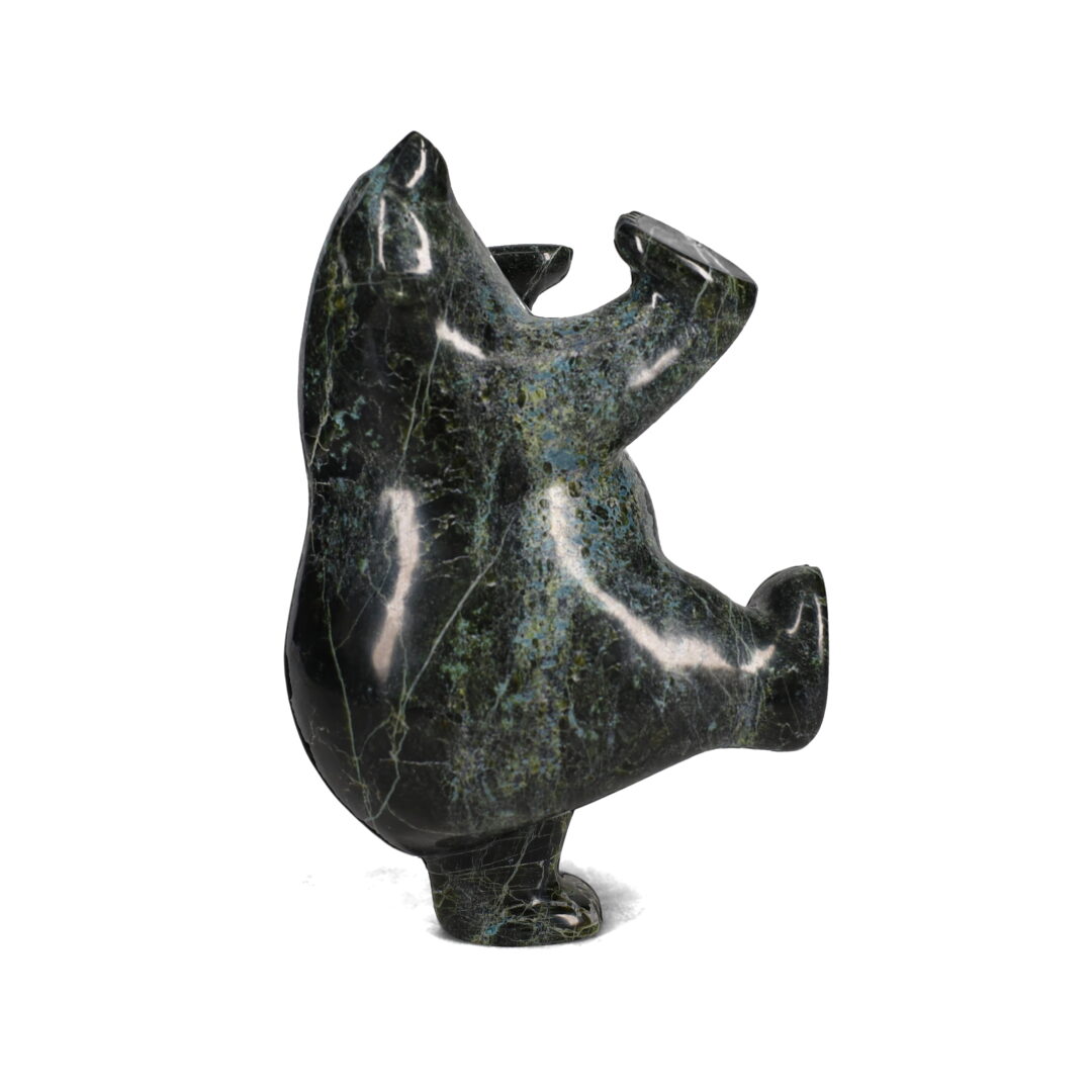 One original hand-carved sculpture by Inuit artist, etidloie addle. One dancing bear carved out of serpentine.