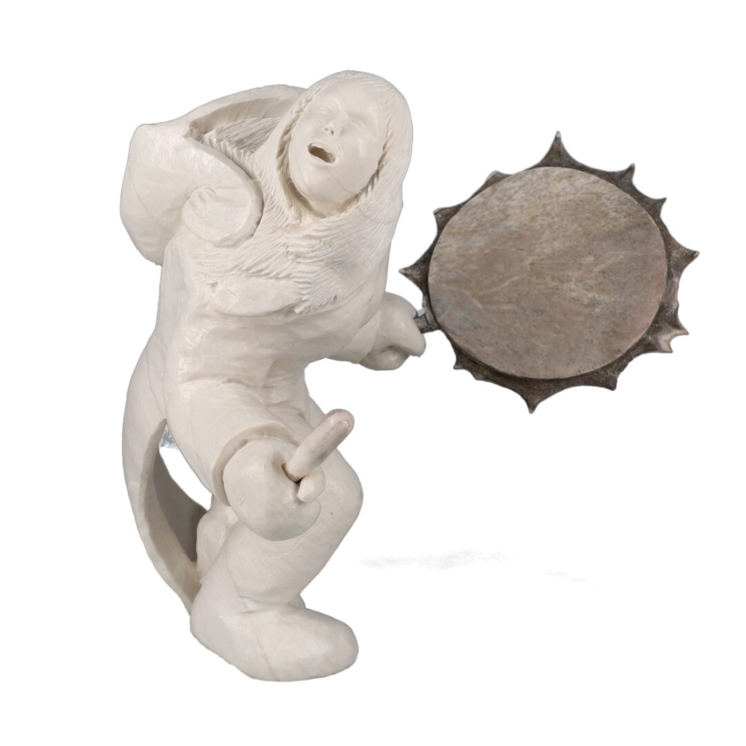 One original hand-carved sculpture by Inuit artist, Bobby Nokalak. One drum dancer carved out of marble and antler.