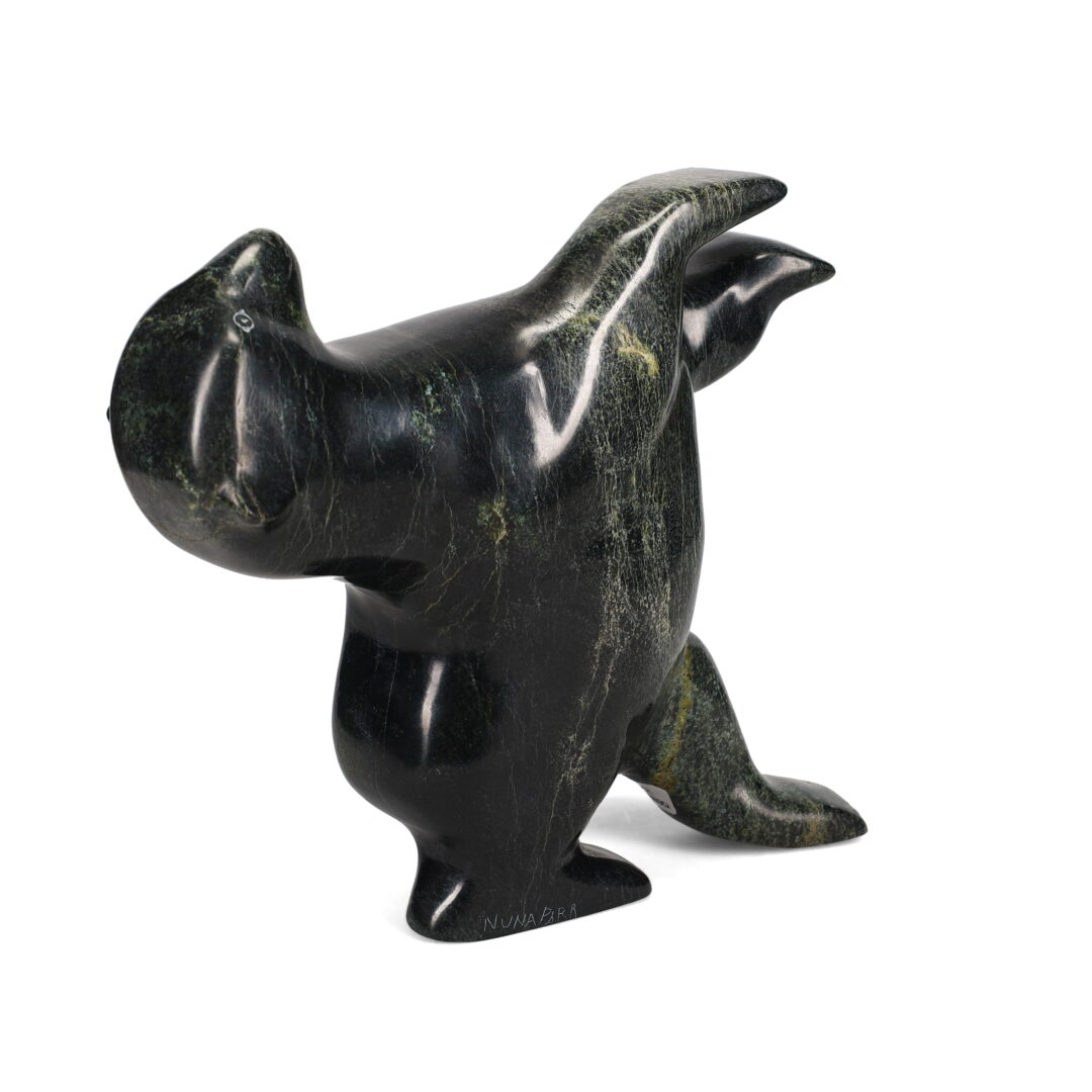 One original hand-carved sculpture by Inuit artist, Nuna Parr. One dancing bear carved out of serpentine stone.