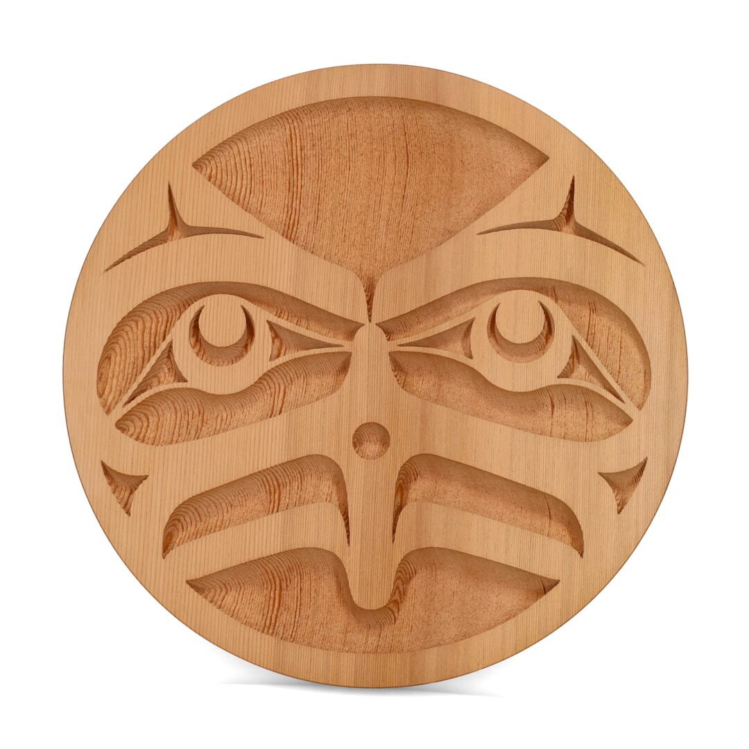 One original wooden panel by Nuxalk artist, Nusmata. One owl carved out of cedar wood, with a natural finish.