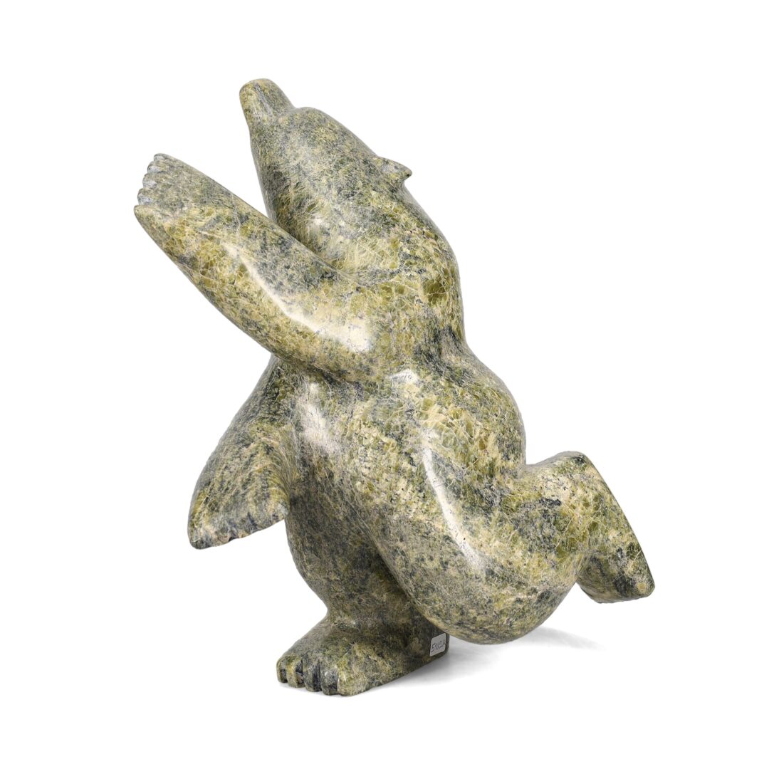 One original hand-carved sculpture by Inuit artist, Palaya Qiatsuk. One dancing bear carved out of serpentine.