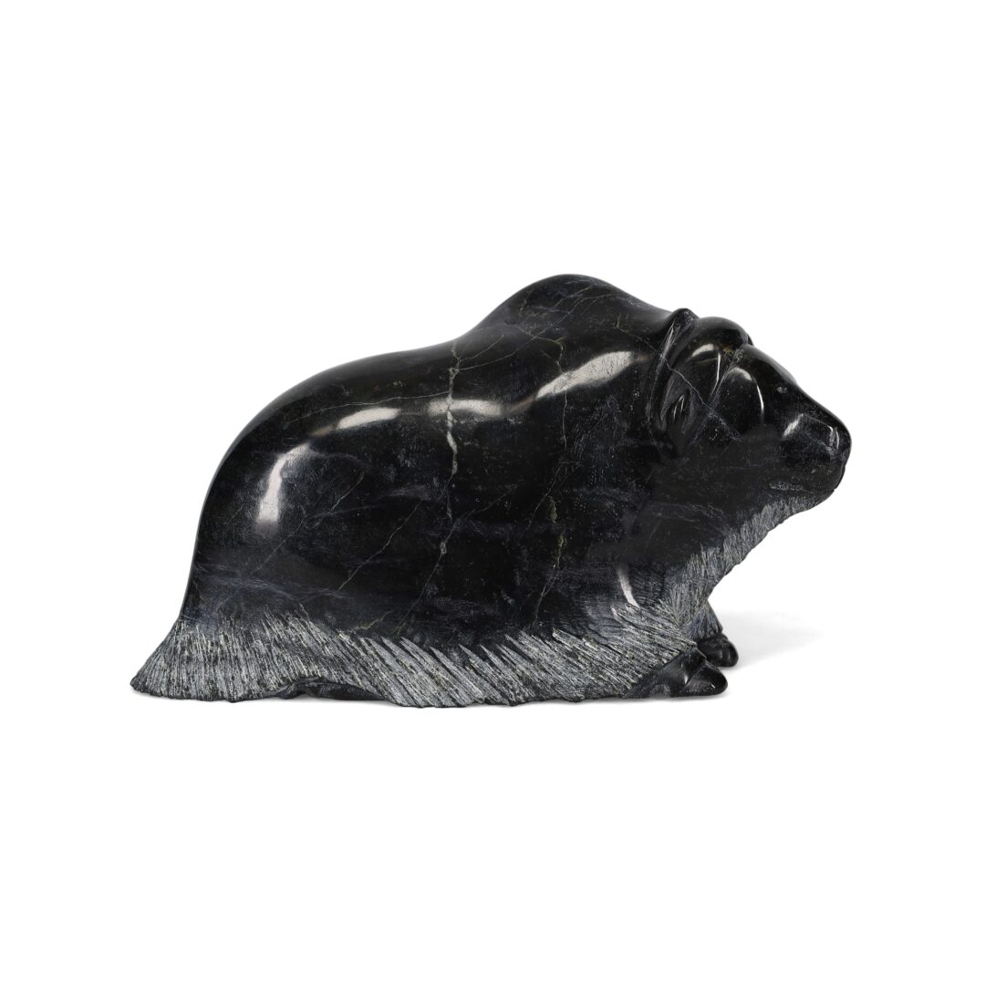 One original hand-carved sculpture by Inuit artist, Pudlalik Shaa. One musk-ox carved out of serpentine stone.