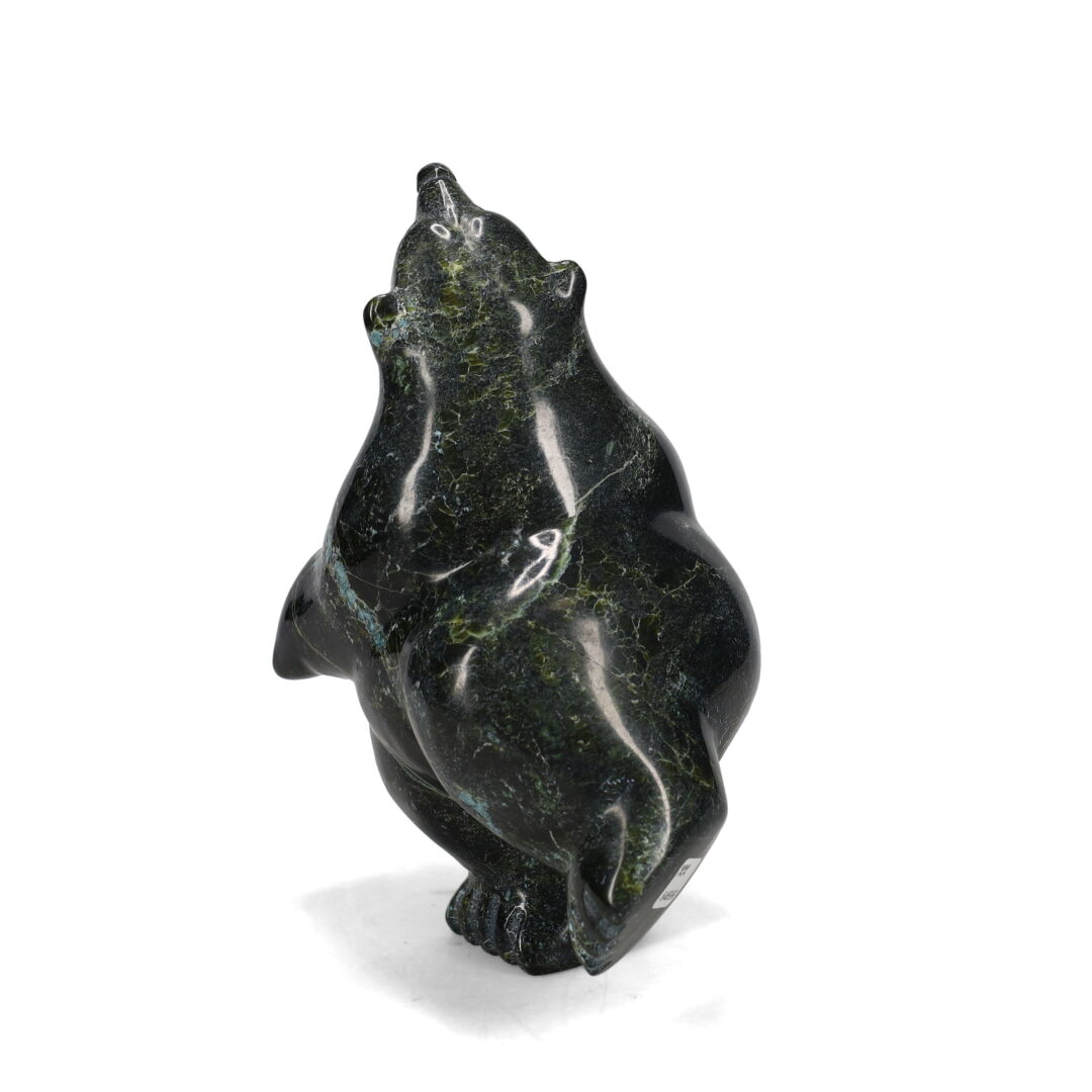 One original hand-carved sculpture by Inuit artist, Samonie Shaa. One dancing bear carved out of serpentine.