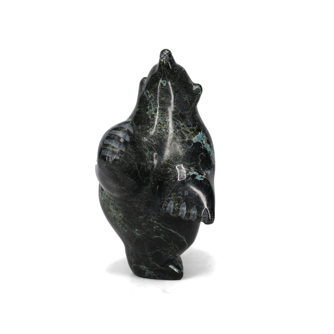 One original hand-carved sculpture by Inuit artist, Samonie Shaa. One dancing bear carved out of serpentine.