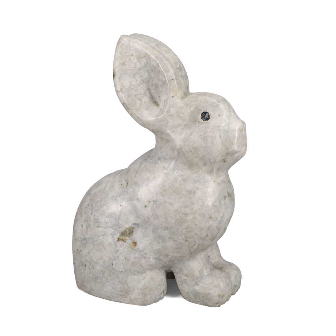 One original hand-carved sculpture by Inuit artist, Johnny Lee Judea. One rabbit carved out of white marble.