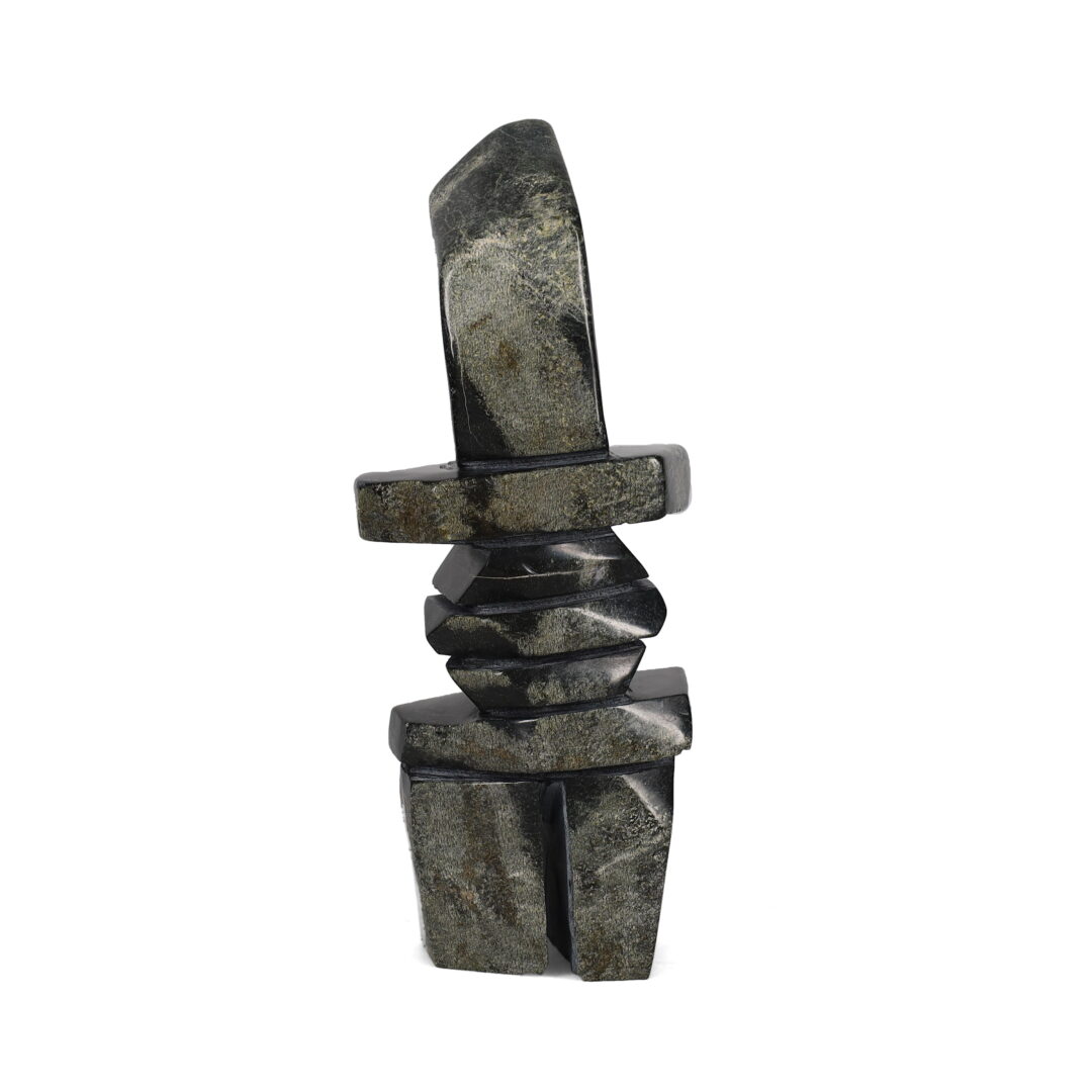 One original hand-carved sculpture by Inuit artist, Robert Oshutsiaq. One inukshuk carved out of serpentine.