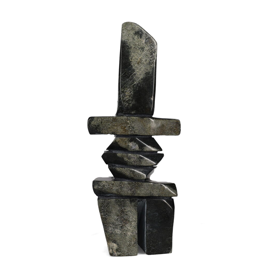 One original hand-carved sculpture by Inuit artist, Robert Oshutsiaq. One inukshuk carved out of serpentine.