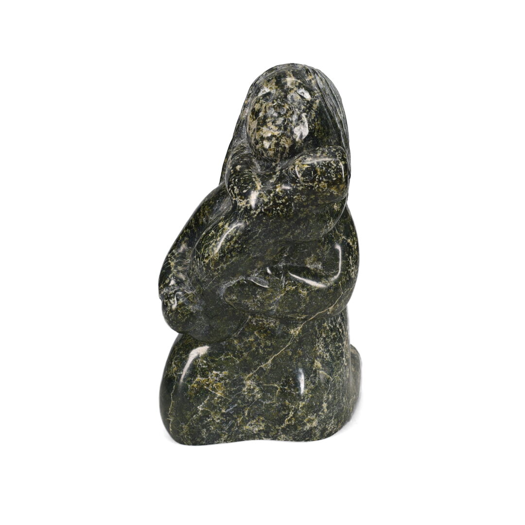 One original hand-carved sculpture by Inuit artist, Markoosie Papigatuk. One mother and child carved out of serpentine.
