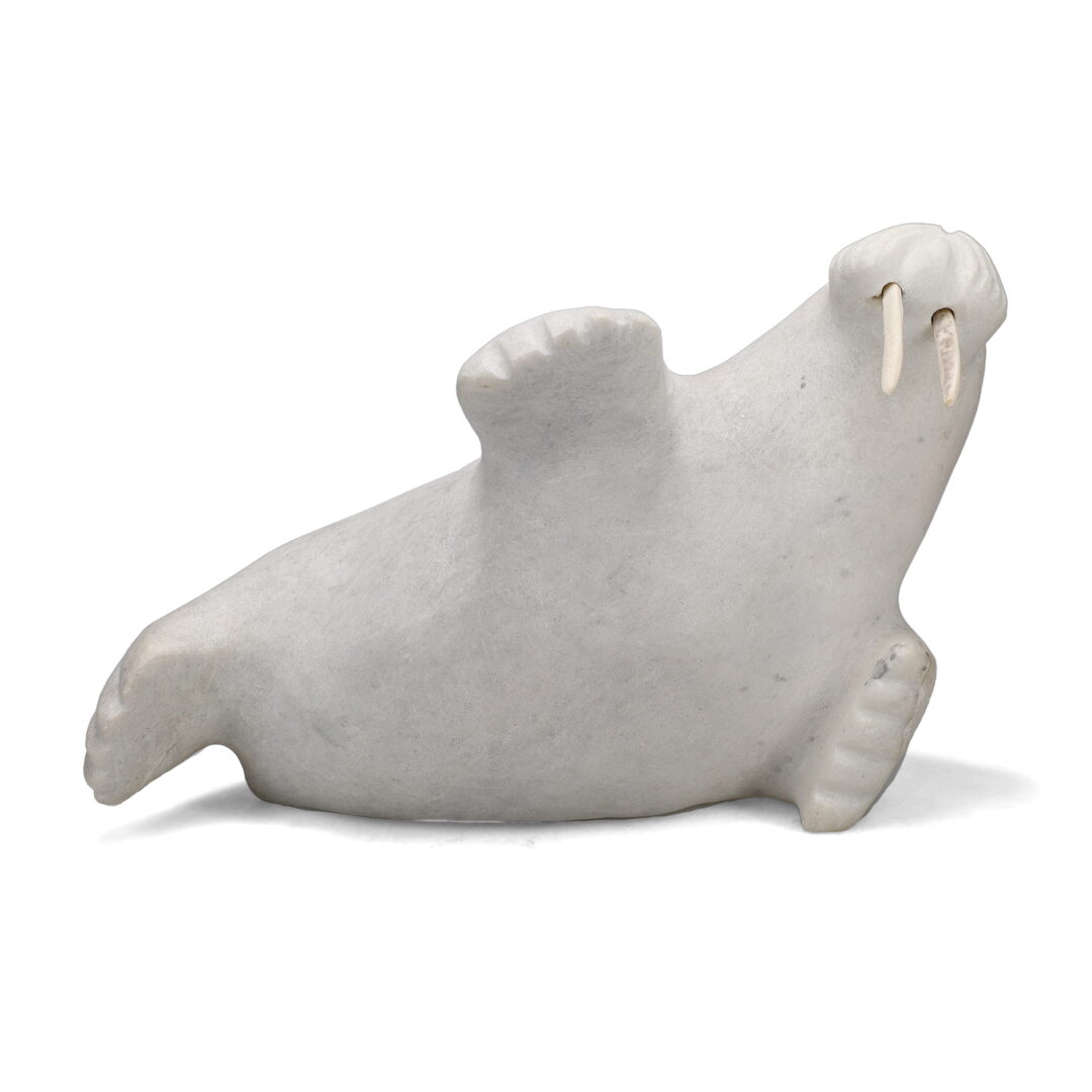 One original hand-carved sculpture by Inuit artist, Axangayuk Sbaa. One walrus carved out of white marble.