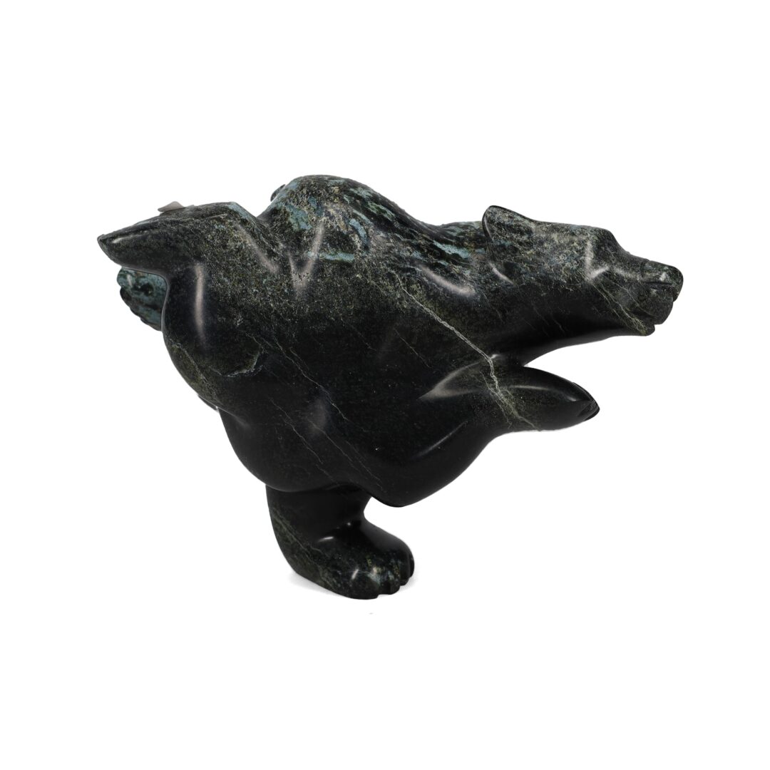 One original hand-carved sculpture by Inuit artist, Ottokie Samayualie. One 2-way bear carved out of serpentine.