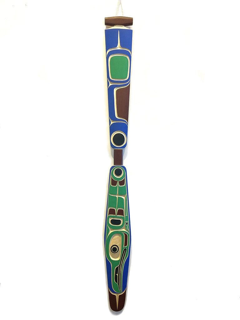 One original hand-carved paddle by Kwakwaka’wakw artist carved out of cedar wood