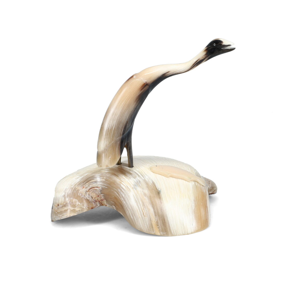 One original hand-carved sculpture by Inuit artist, Buddy Nutik Alikanik. One bird carved out of a muskox horn.