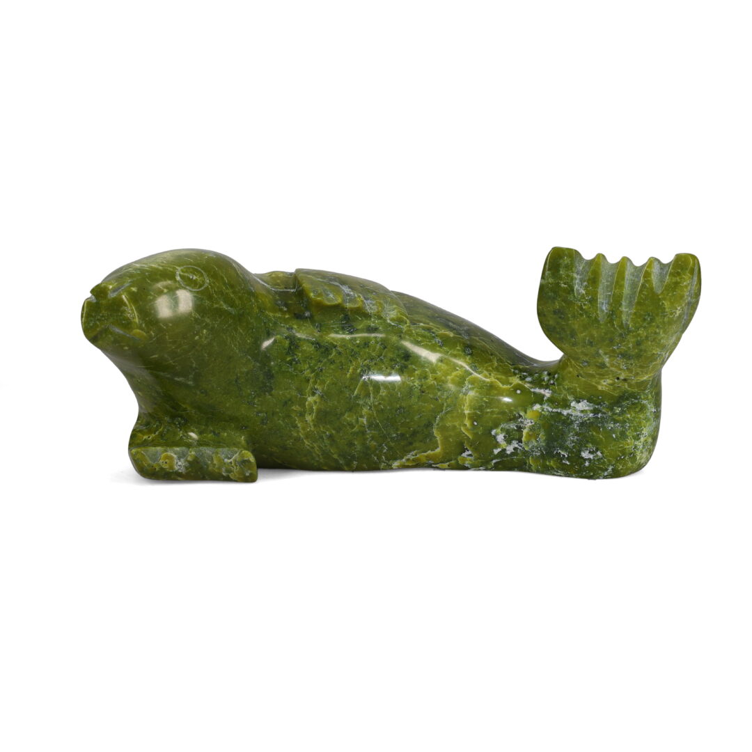 One original hand-carved sculpture by Inuit artist, Sammy Kolola. One seal carved out of serpentine stone.