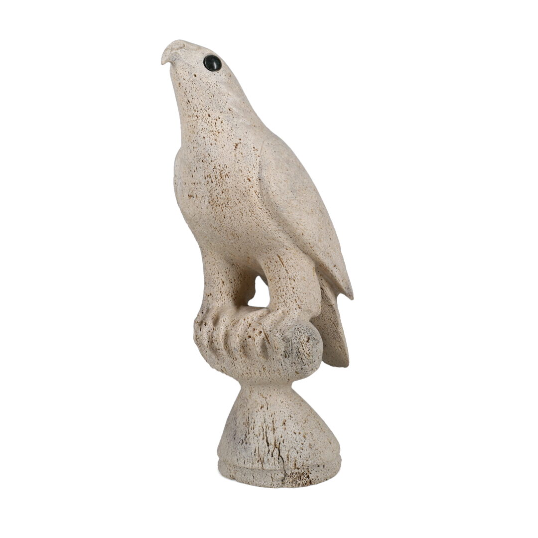 One original hand-carved sculpture by Inuit artist, Charlie Ugyuk. One bird carved out of fossilized whale bone.