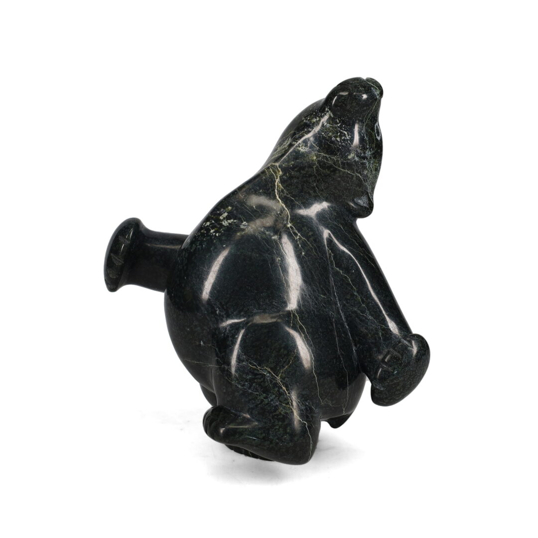 One original hand-carved sculpture by Inuit artist, Markoosie Papigatok. One dancing bear carved out of serpentine.
