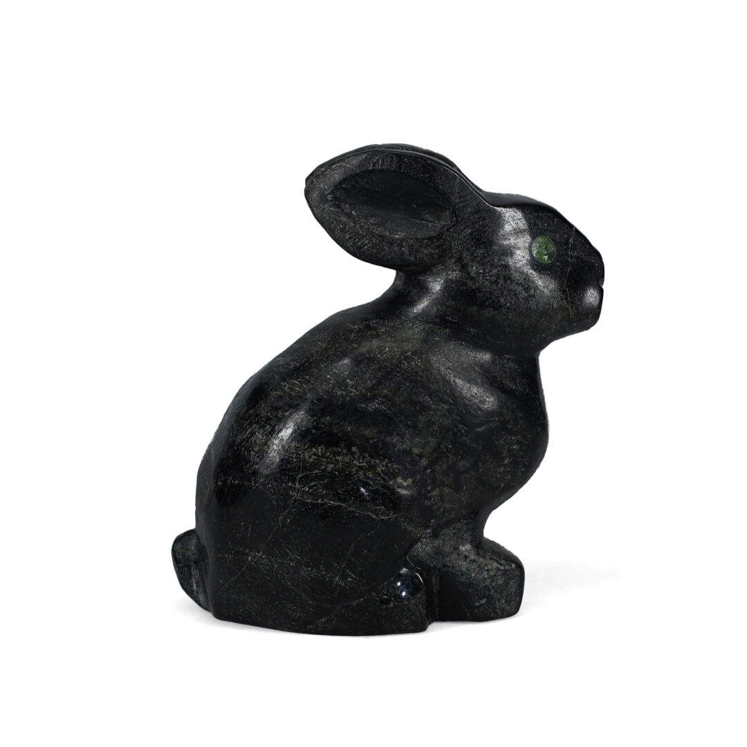 One original hand-carved sculpture by Inuit artist, Johnny Lee Judea. One rabbit carved out of serpentine.