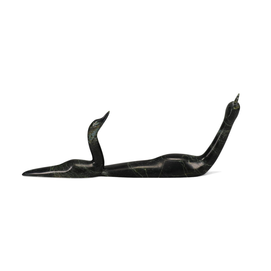 One original hand-carved sculpture by Inuit artist, Ning Ashoona. One pair of loons carved out of serpentine.