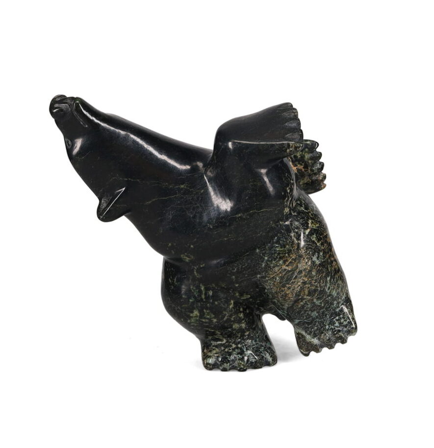One original hand-carved sculpture by Inuit artist, Ottokie Samauyalie. One dancing bear carved out of serpentine.