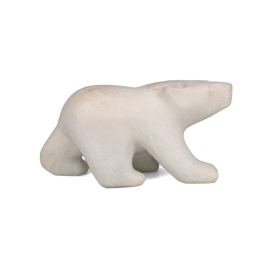 One original hand-carved sculpture by Inuit artist, Allan Shutiapik. One walking bear carved out of marble.