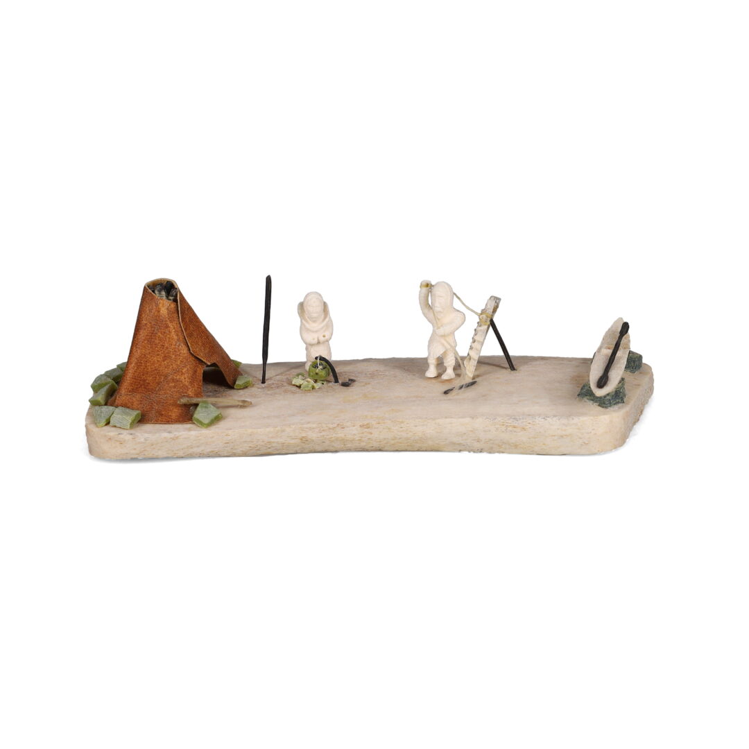 One original hand-carved sculpture by Inuit artist, Daniel Schimout. One campsite scene carved out of bone and ivory.