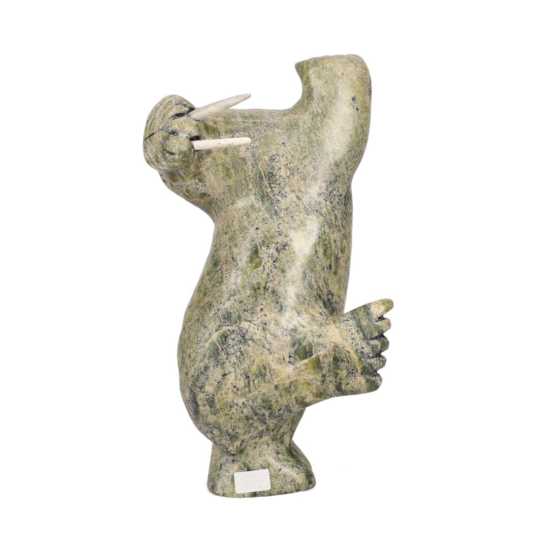 One original hand-carved sculpture by Inuit artist, Qavavau Shaa. One dancing walrus carved out of serpentine.