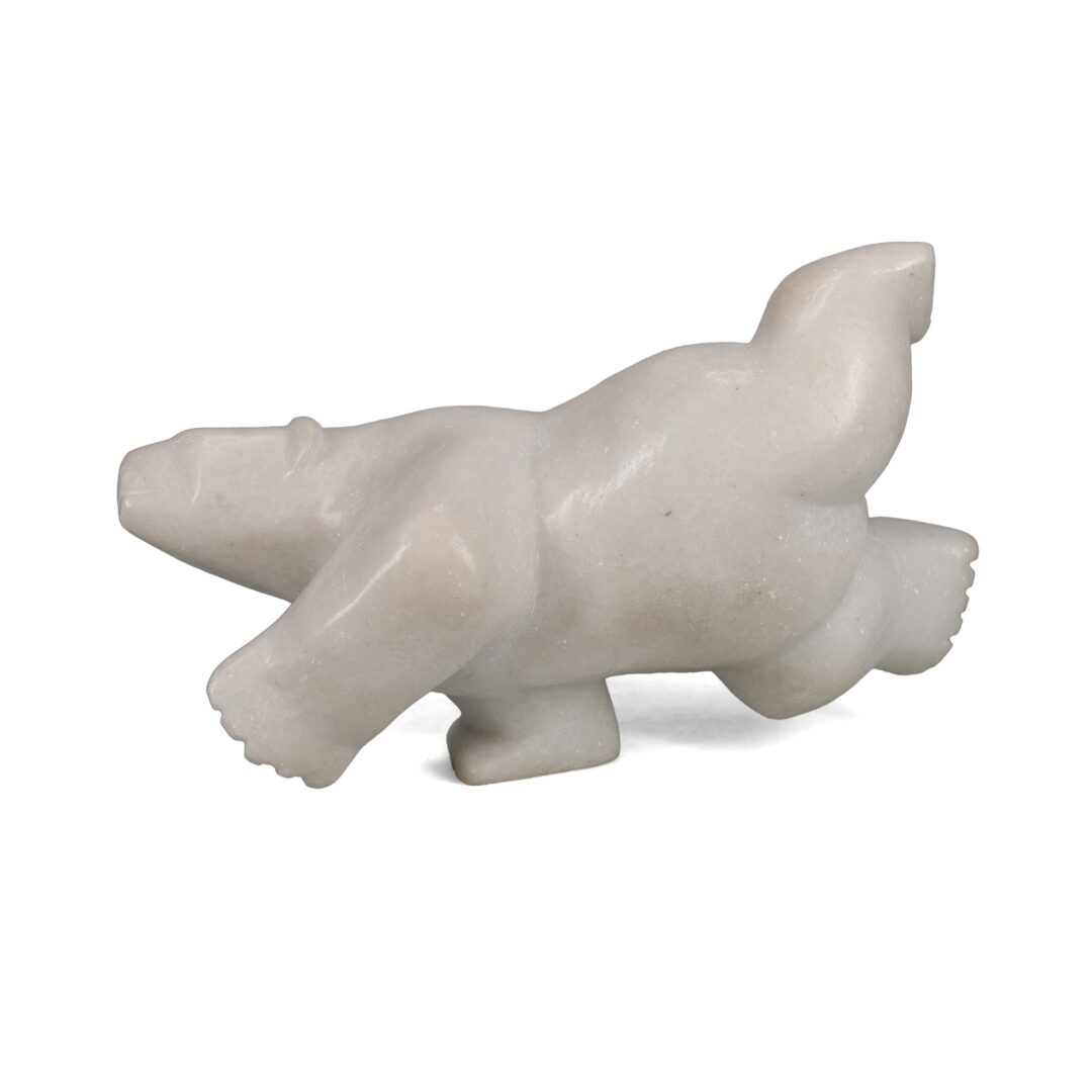 One original hand-carved sculpture by Inuit artist, Luca Mikkigak. One diving bear carved out of white marble.