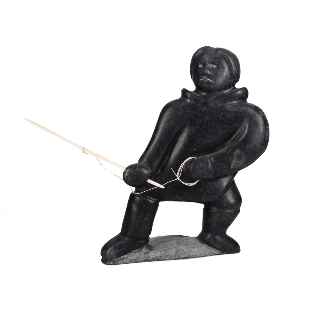 One original hand-carved sculpture by an unknown Inuit artist. One hunter with spear carved out of basalt stone.