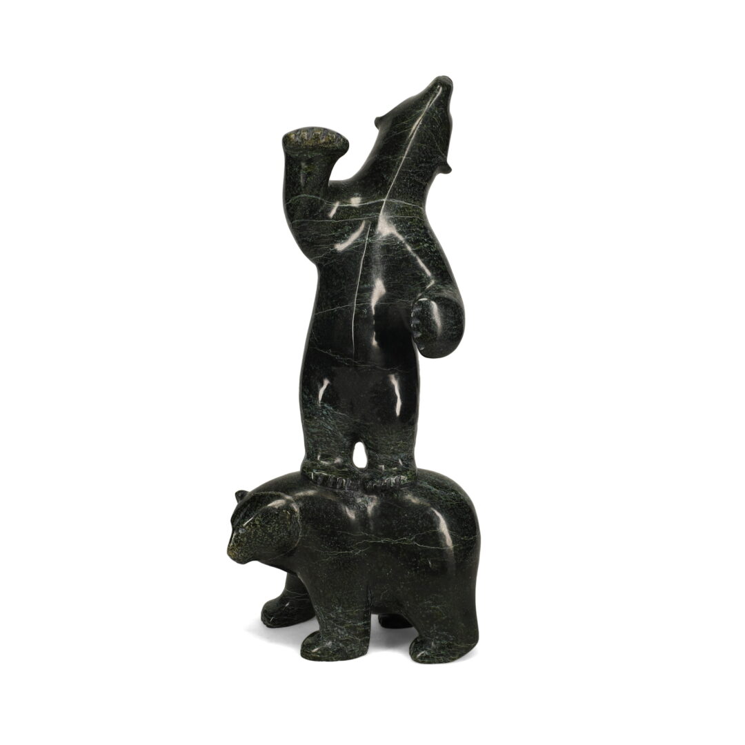 One original hand-carved sculpture by Inuit artist, Etidloie Adla. Two bears playing carved out of serpentine.