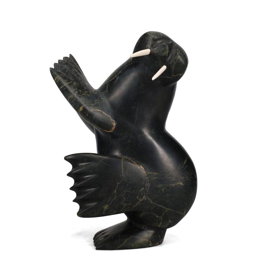 One original hand-carved sculpture by Inuit artist, Alariaq Shaa. One dancing walrus carved out of serpentine.