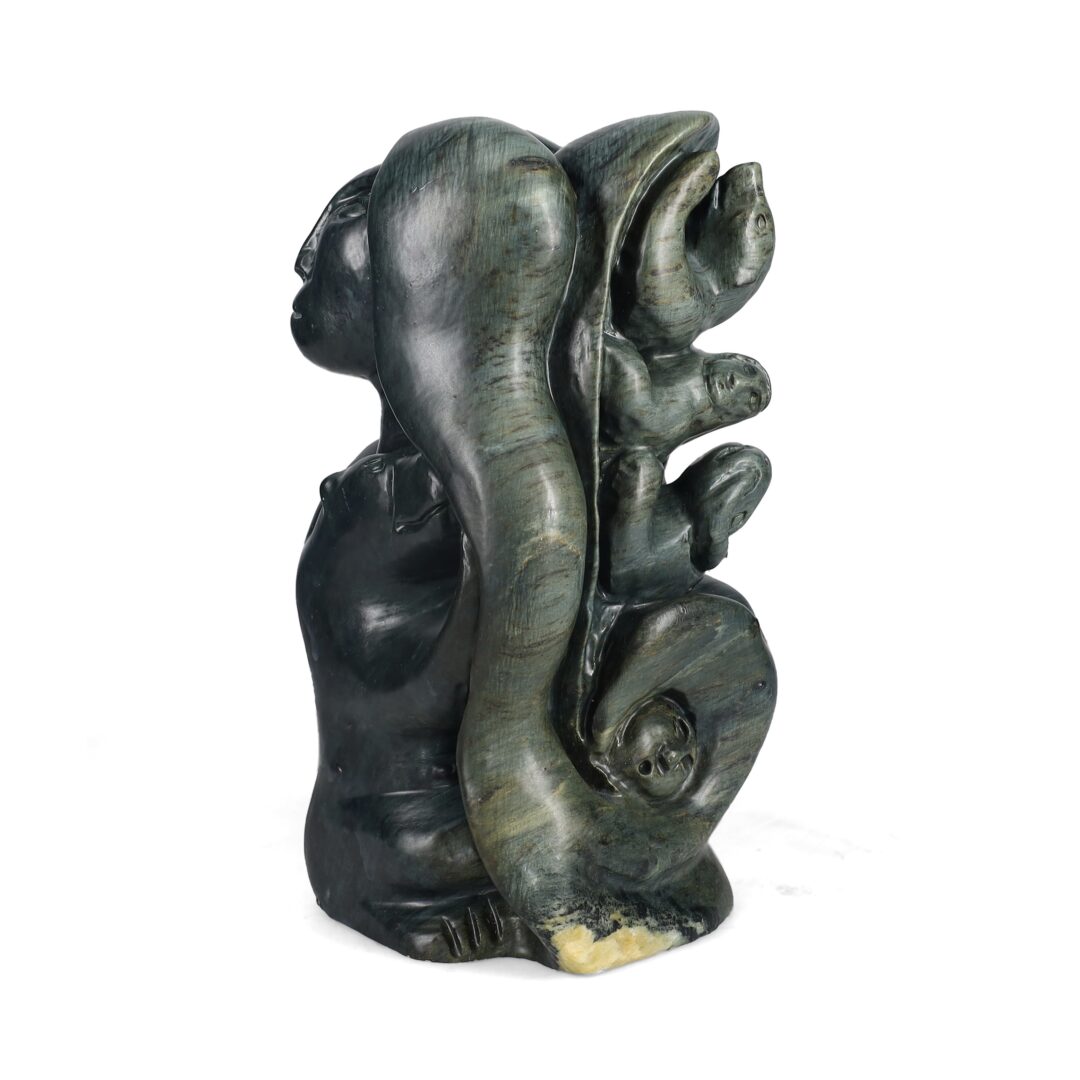 One original hand-carved sculpture by Inuit artist, Jonasie Faber. One Sedna umiak carved out of soapstone.