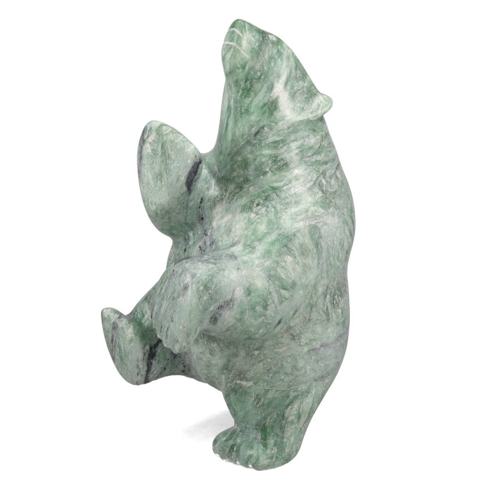 One original hand-carved sculpture by Inuit artist, Etidloie Adla. One dancing bear carved out of soapstone.